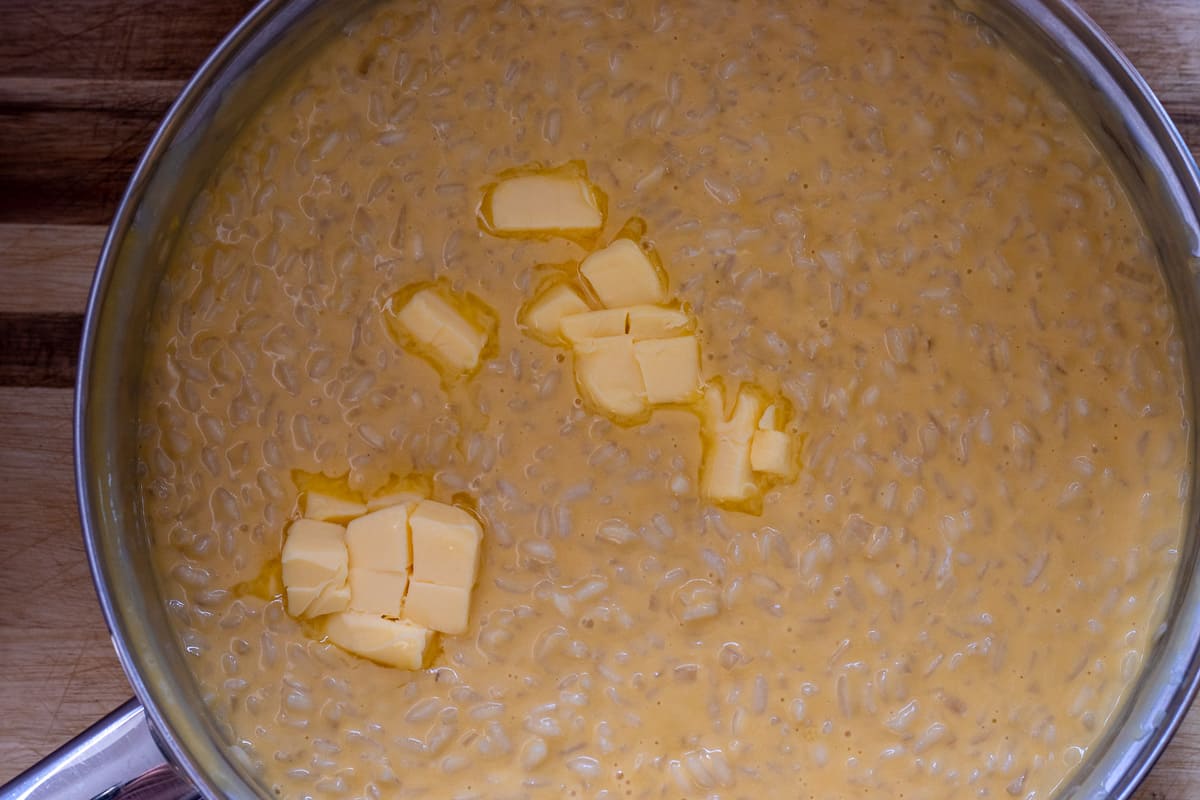 adding butter to risotto