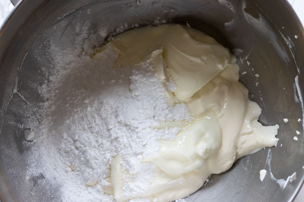 sour cream and icing sugar in a mixing bowl