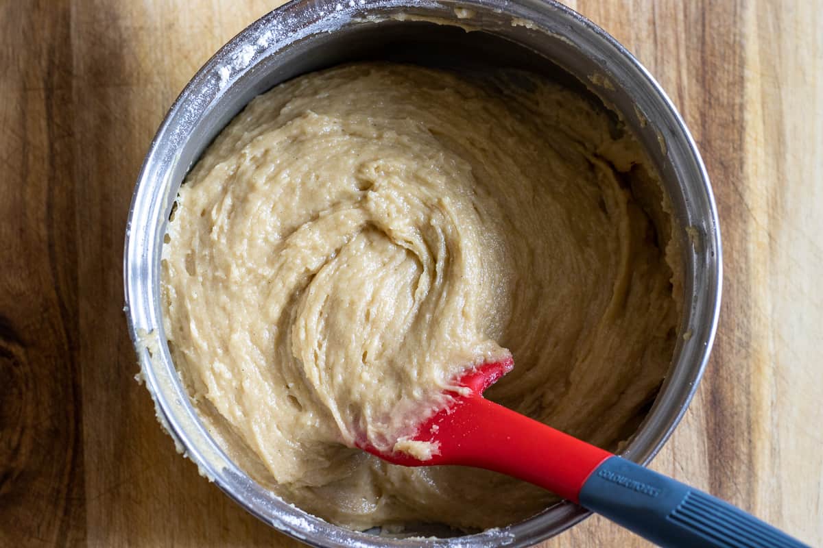 folding the flour into the honey mixture to form a dough