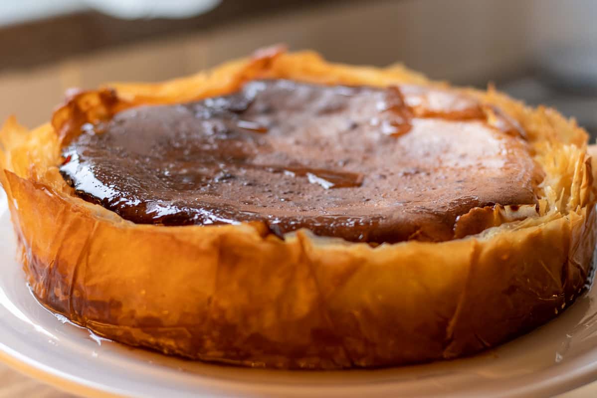 the syrup is carefully drizzled on filo crust