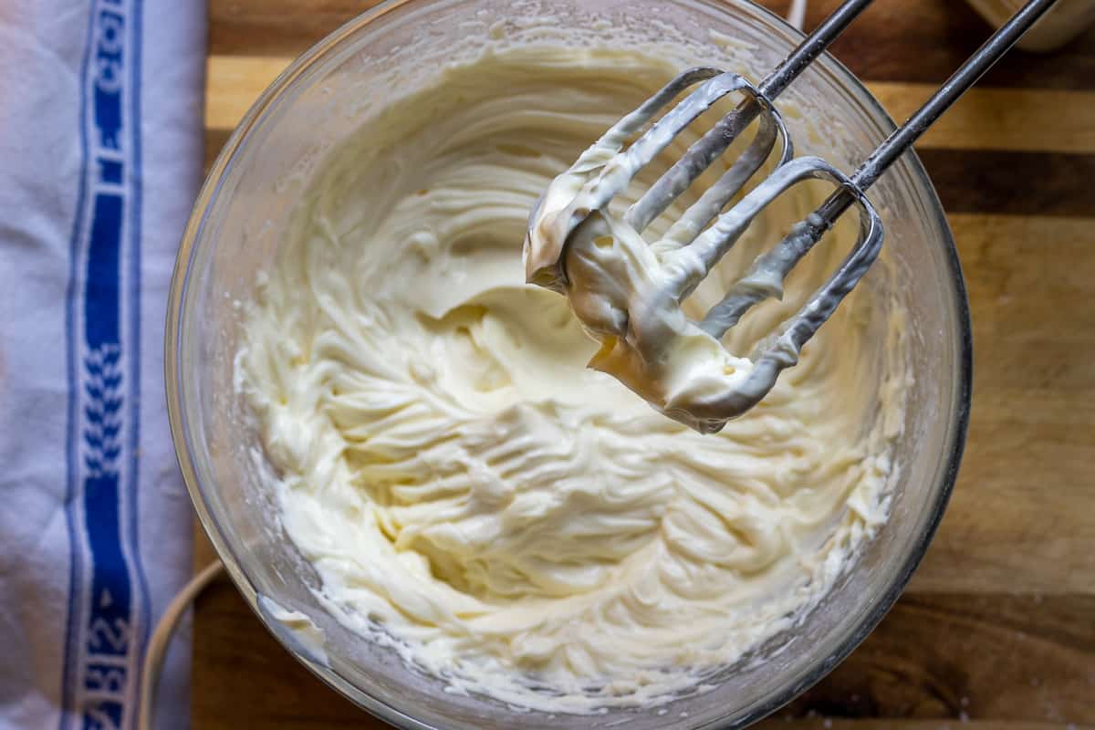 cream cheese and icing sugar are beaten until fluffy