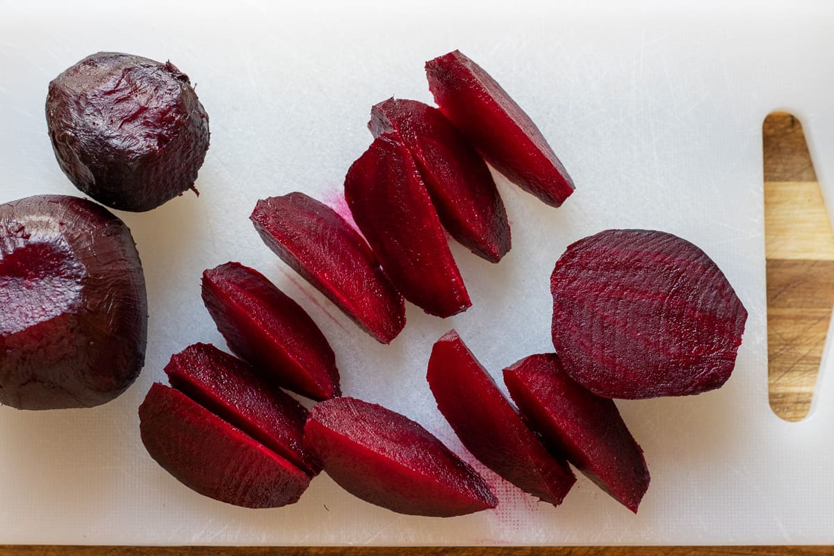 cooked beetroots are peeled and cut into wedges