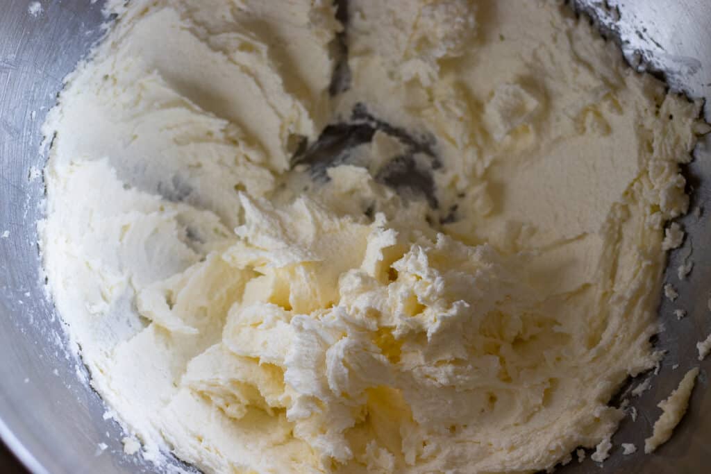 Sugar and soft butter are beaten until fluffy.