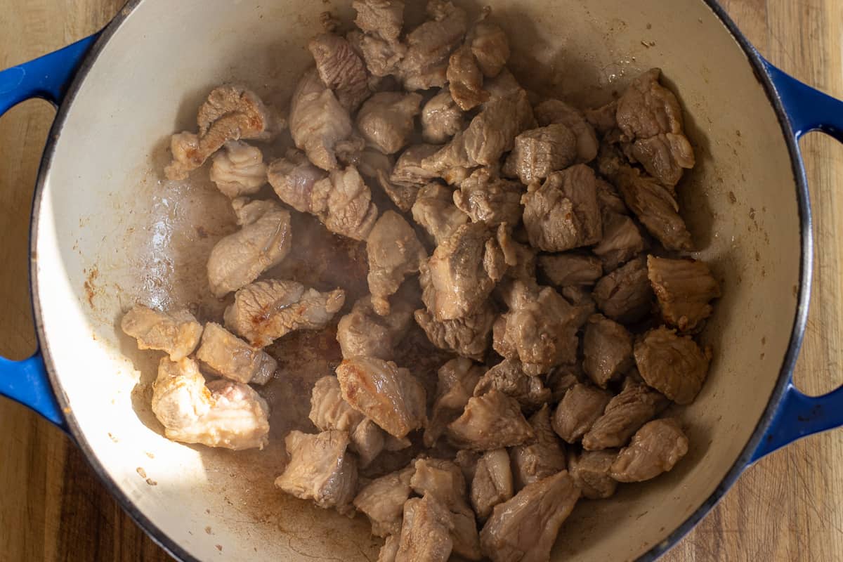 browning the lamb in a Dutch oven
