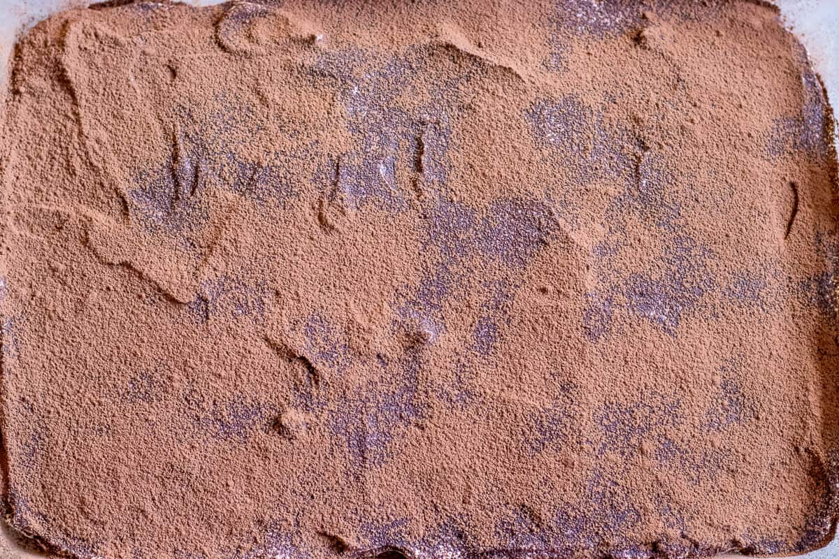 the cacao powder is dusted over the mascarpone filling