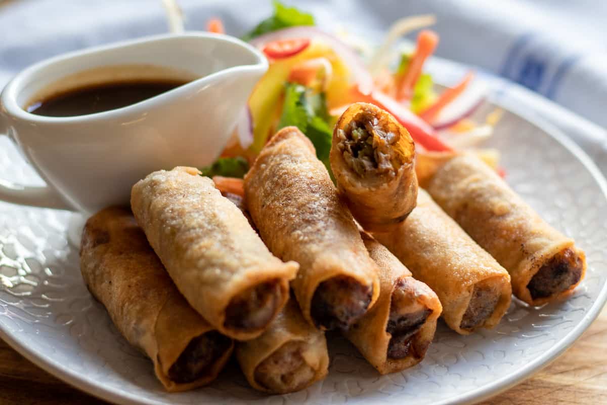 crispy duck spring rolls served with thai salad and hoisin sauce