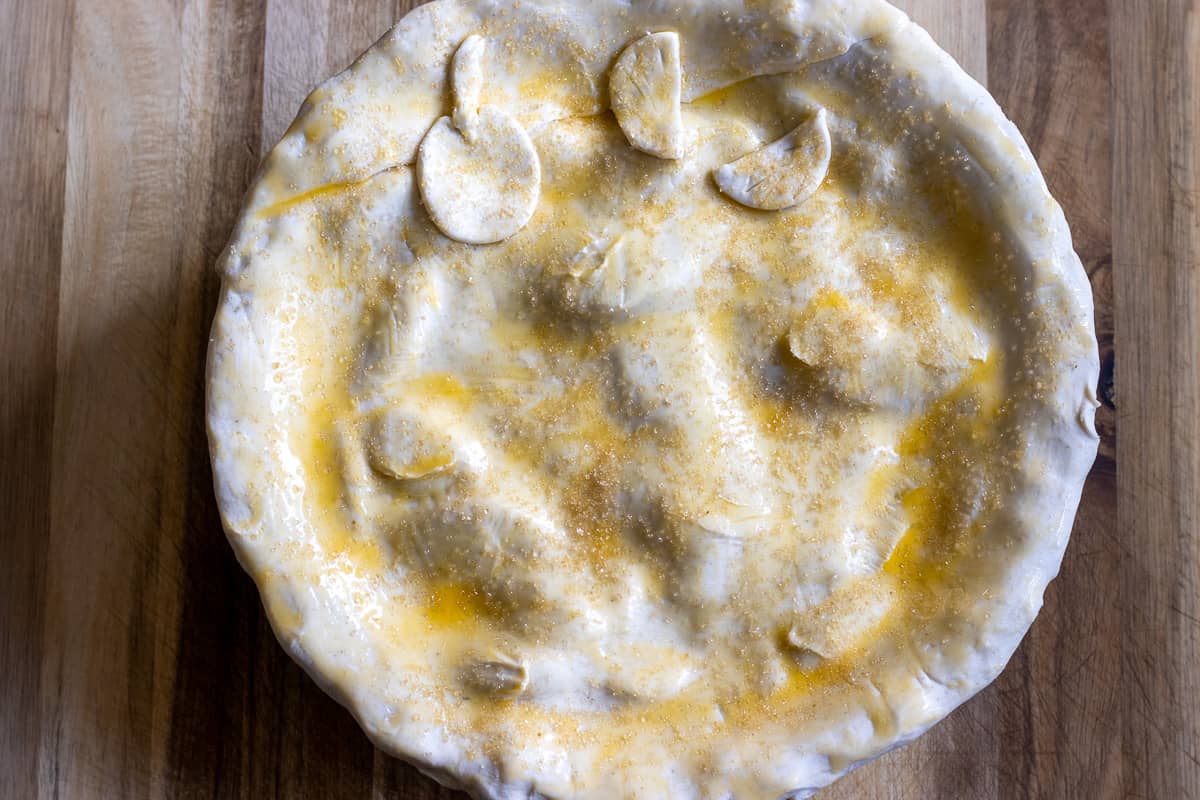 apple pie is egg washed and ready to bake