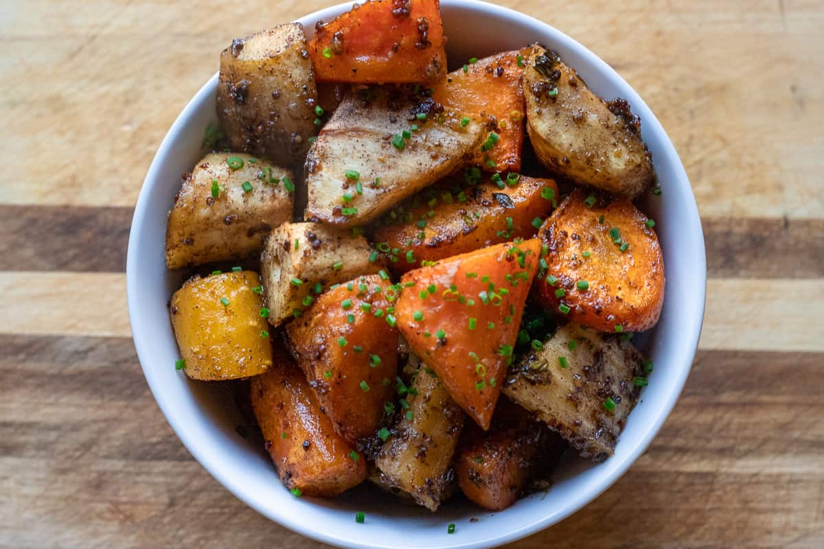 honey glazed parsnips and carrots are served in a bowl