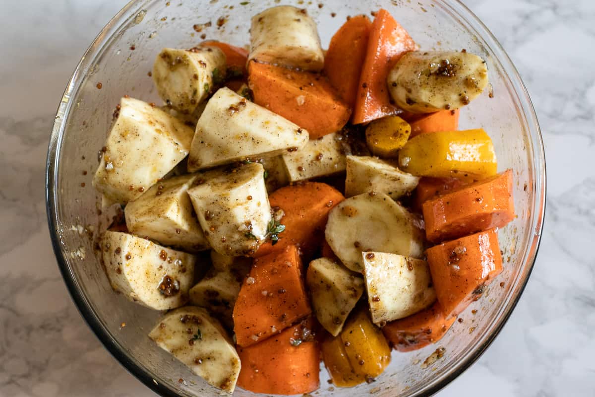 parsnips and carrots are covered with honey glaze