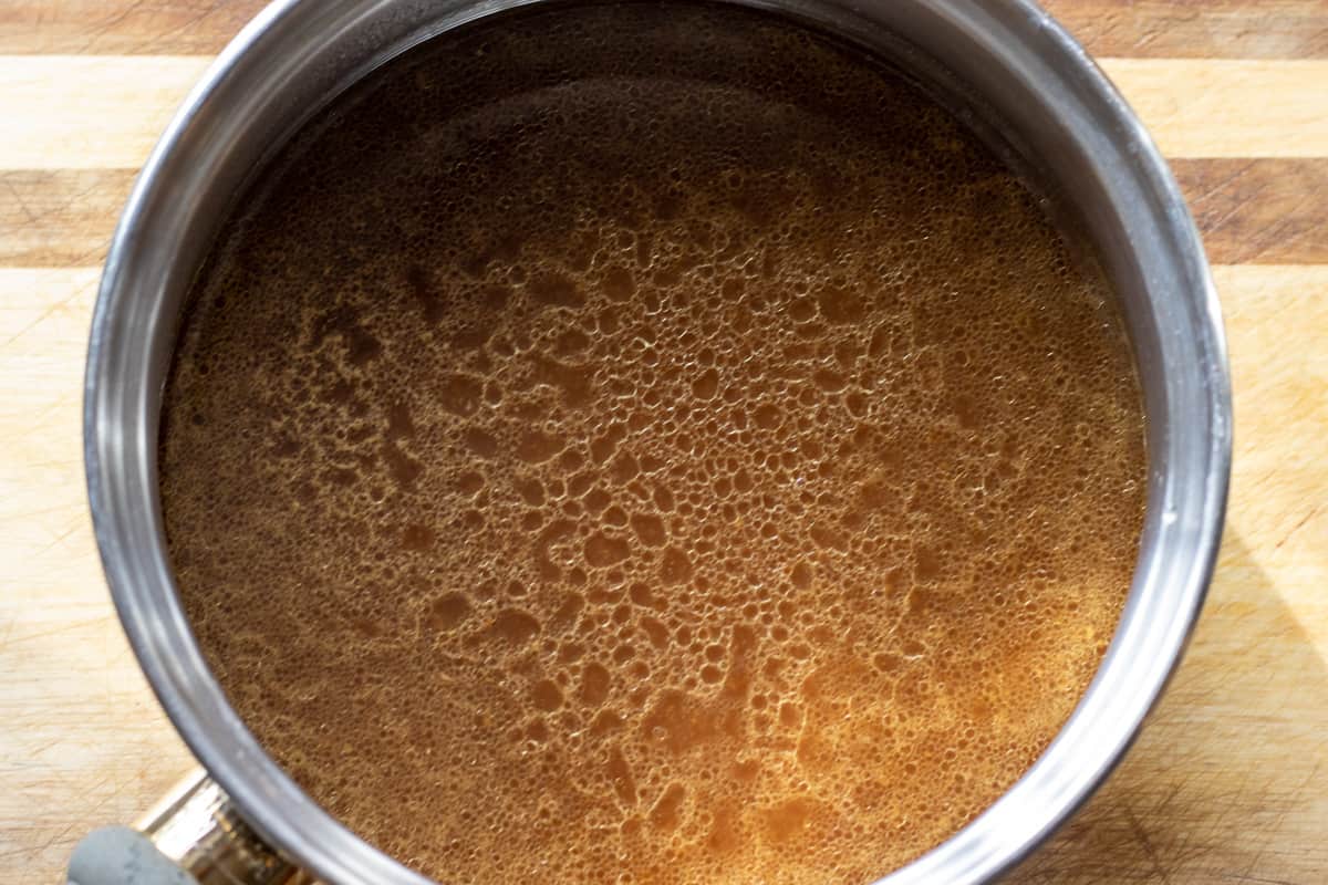 gravy is poured in a saucepan