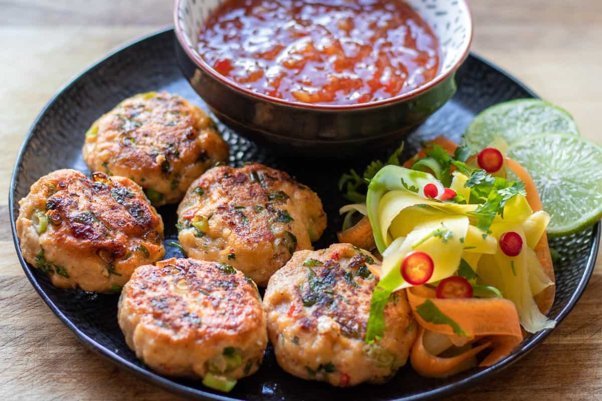 thai fish cakes-too fun places served with chili sauce and salad