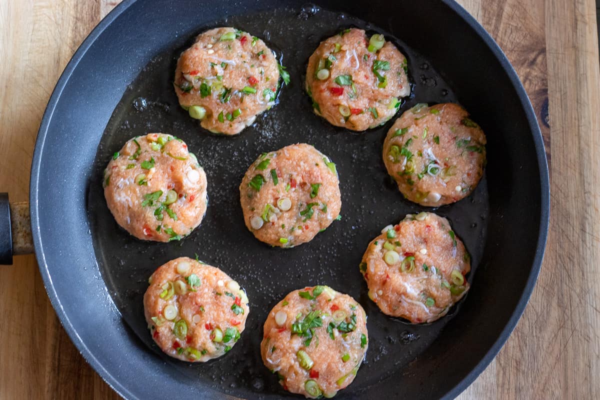 pan frying 8 pieces of fish cakes in oil