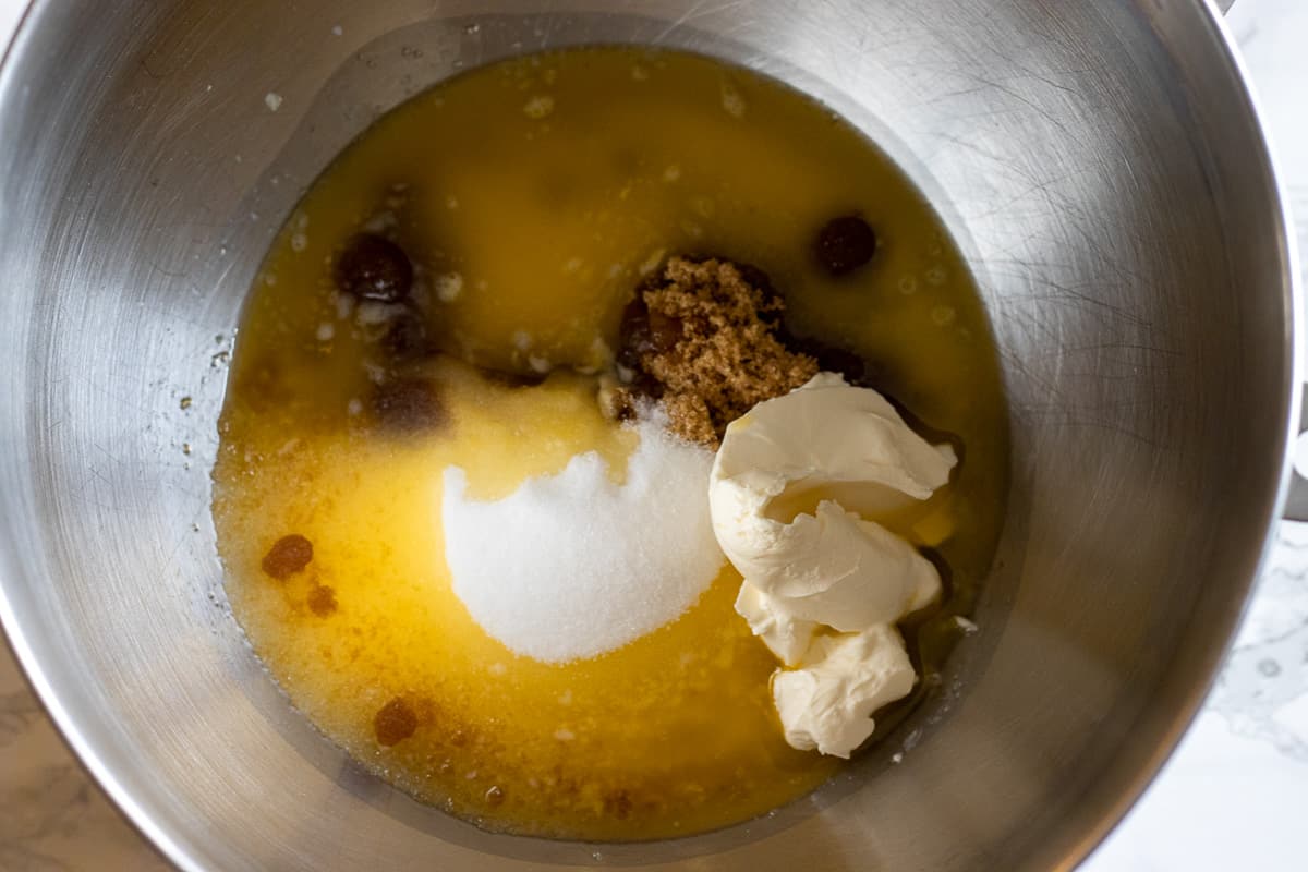 sugar, butter and cream cheese are placed in a bowl
