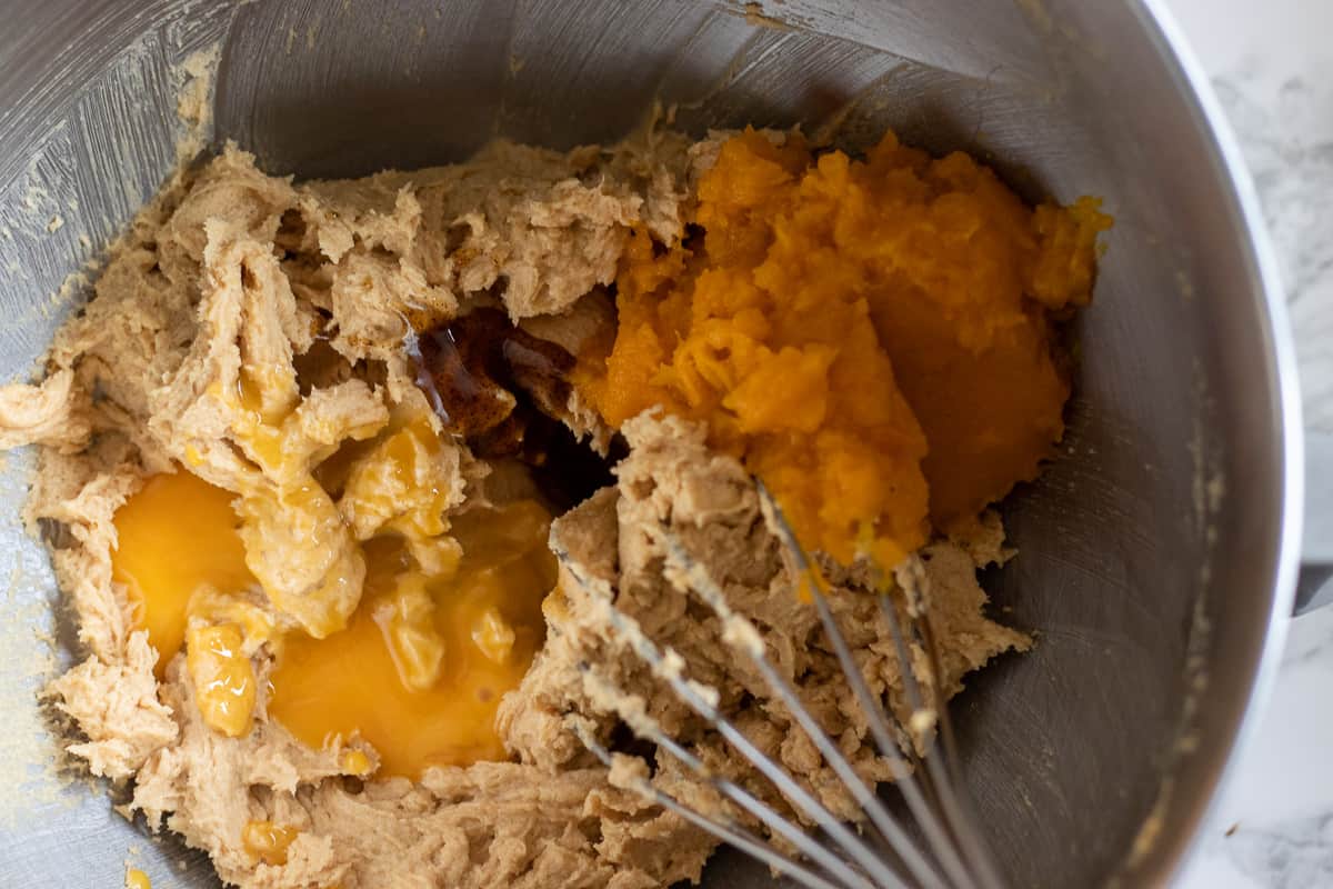 egg yolks, vanilla and pumpkin purée are added to the bowl