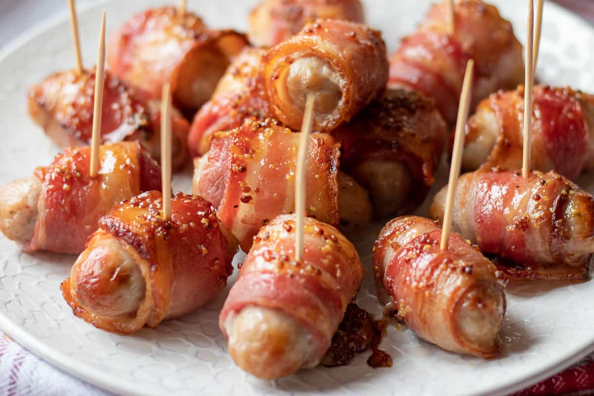 mini pigs in a blanket served with skewers