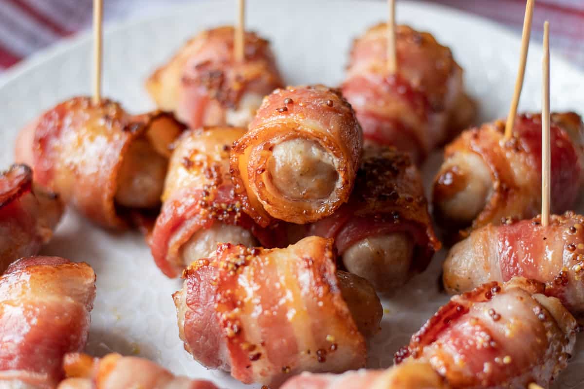 mini pigs in blankets served on skewers as a finger food