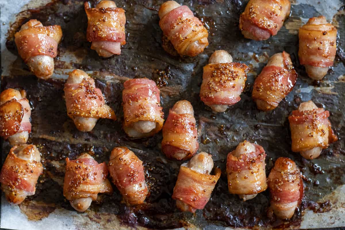 mini pigs in a blanket are cooked until giolden crispy