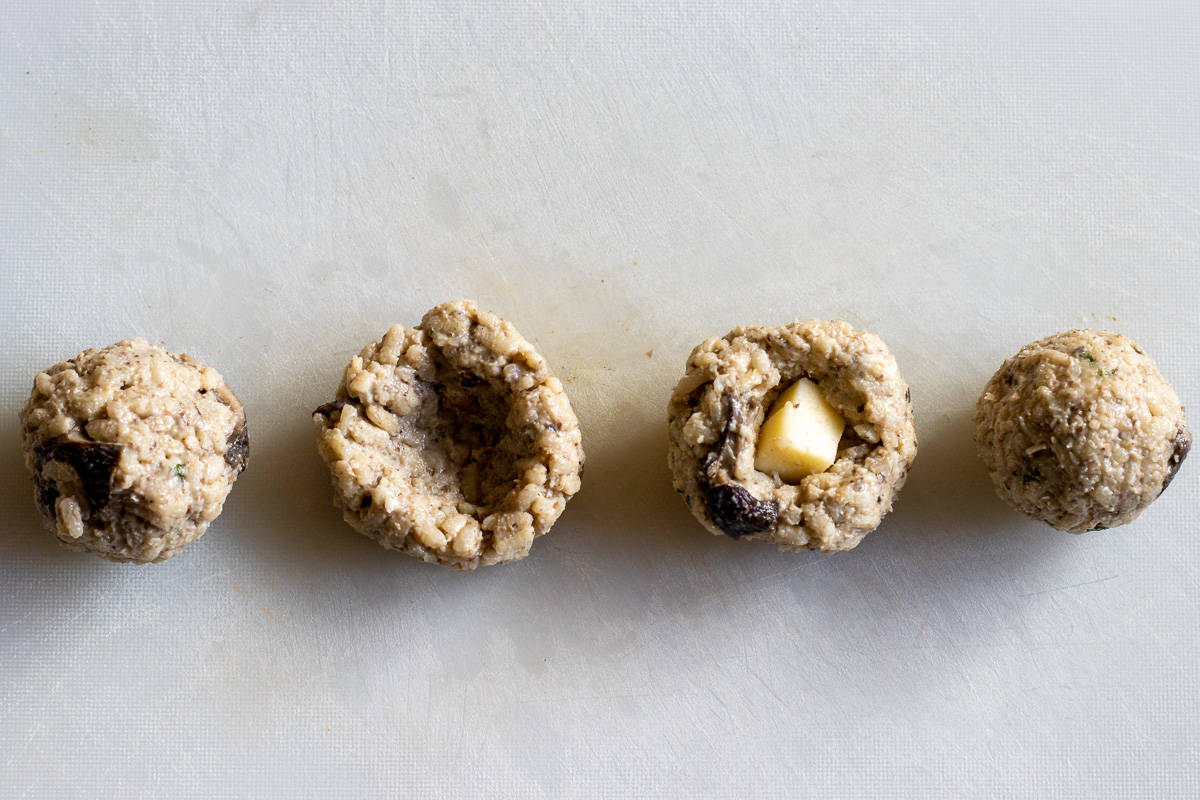 shaping arancini balls from leftover risotto