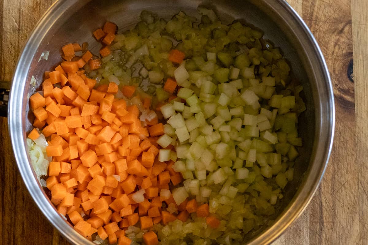 the carrots, garlic and celery are added to the sautéed onions