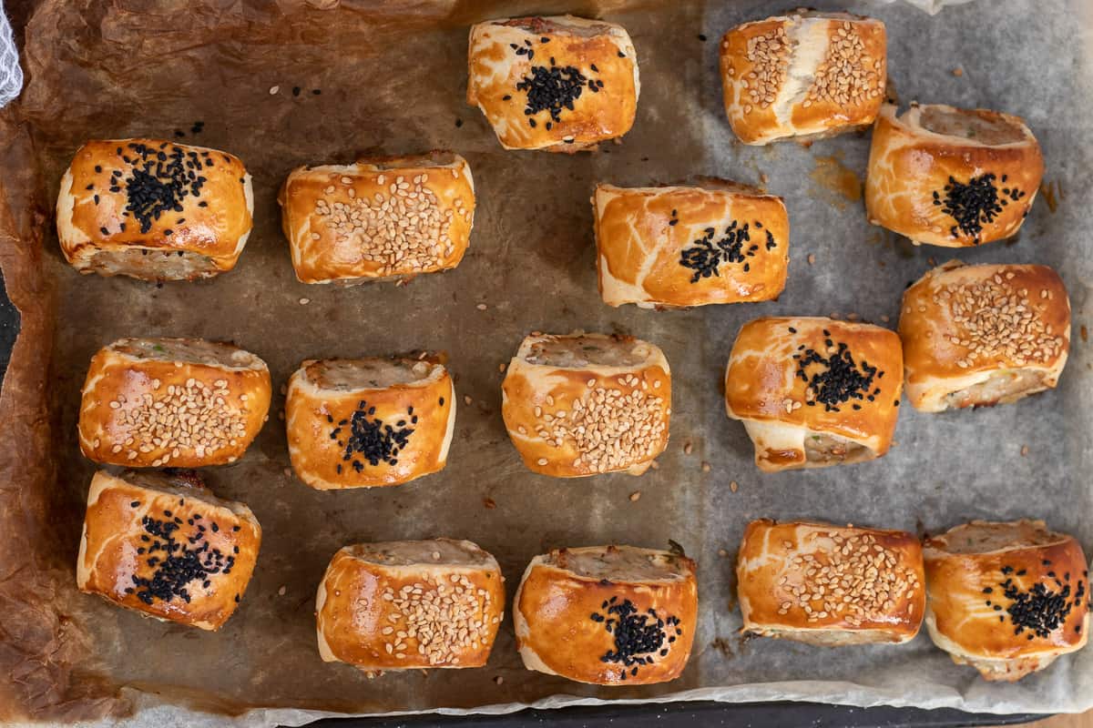 Shortcrust pastry mini sausage rolls are baked until golden and crispy