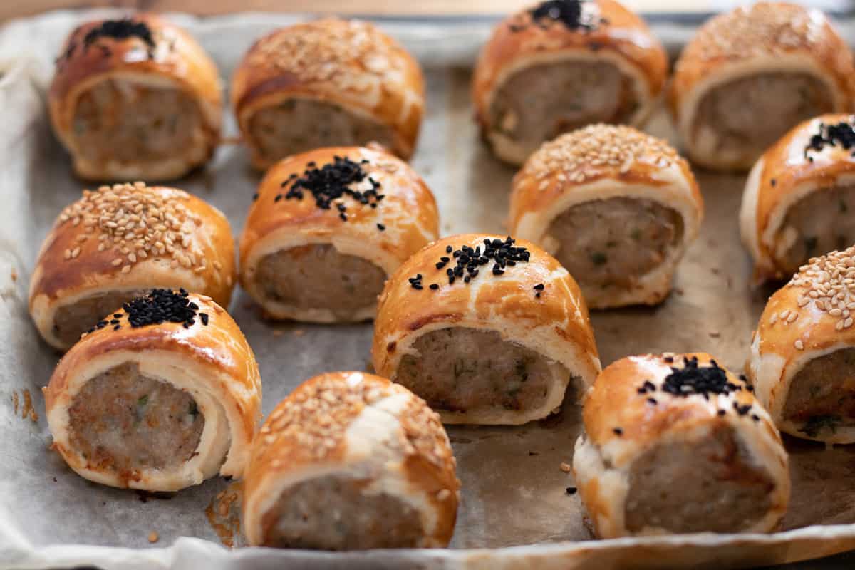 mini sausage rolls on baking sheet