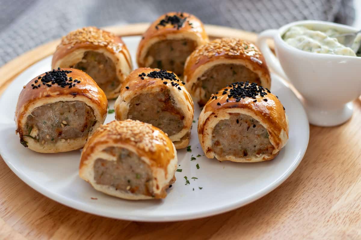 mini sausage rolls served with tartar sauce on the side