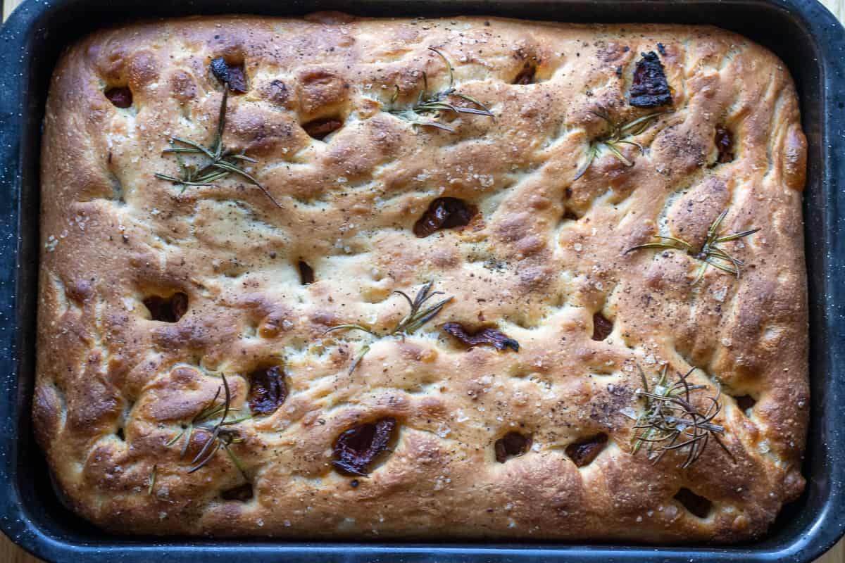 Freshly baked bread in a tray.