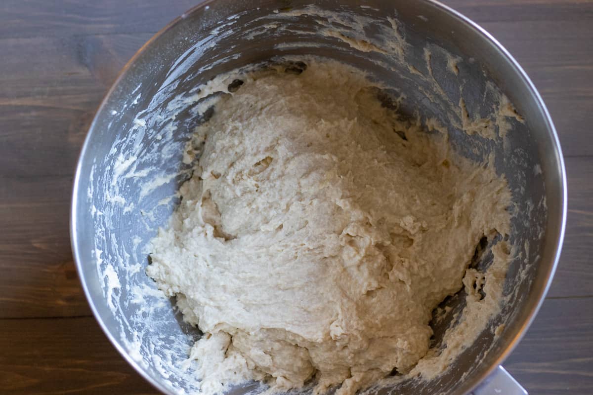 The flour, salt and olive oil is added to form a dough.