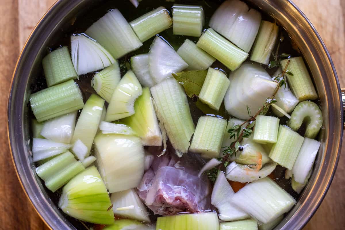 giblets, neck, mirepoix and aromatics are placed in a pan with cold water for Perfect Roast Turkey Recipe - Easy Method