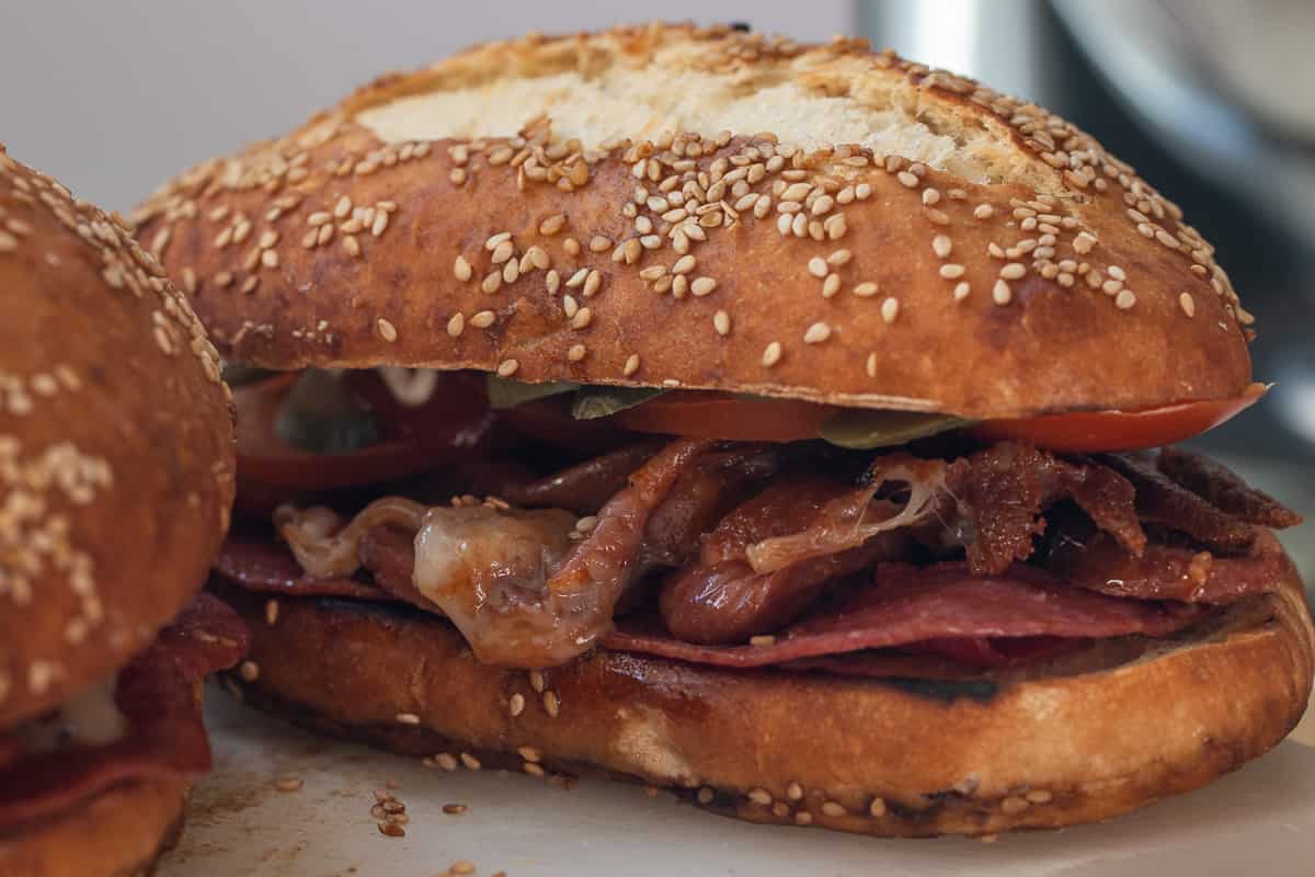 kumru sandwich made with sucuk, salami, Kasar cheese and tomatoes