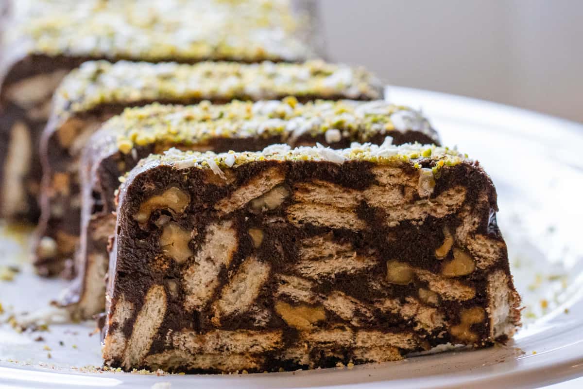 Lazy cake - chocolate biscuit cake is sliced before serving
