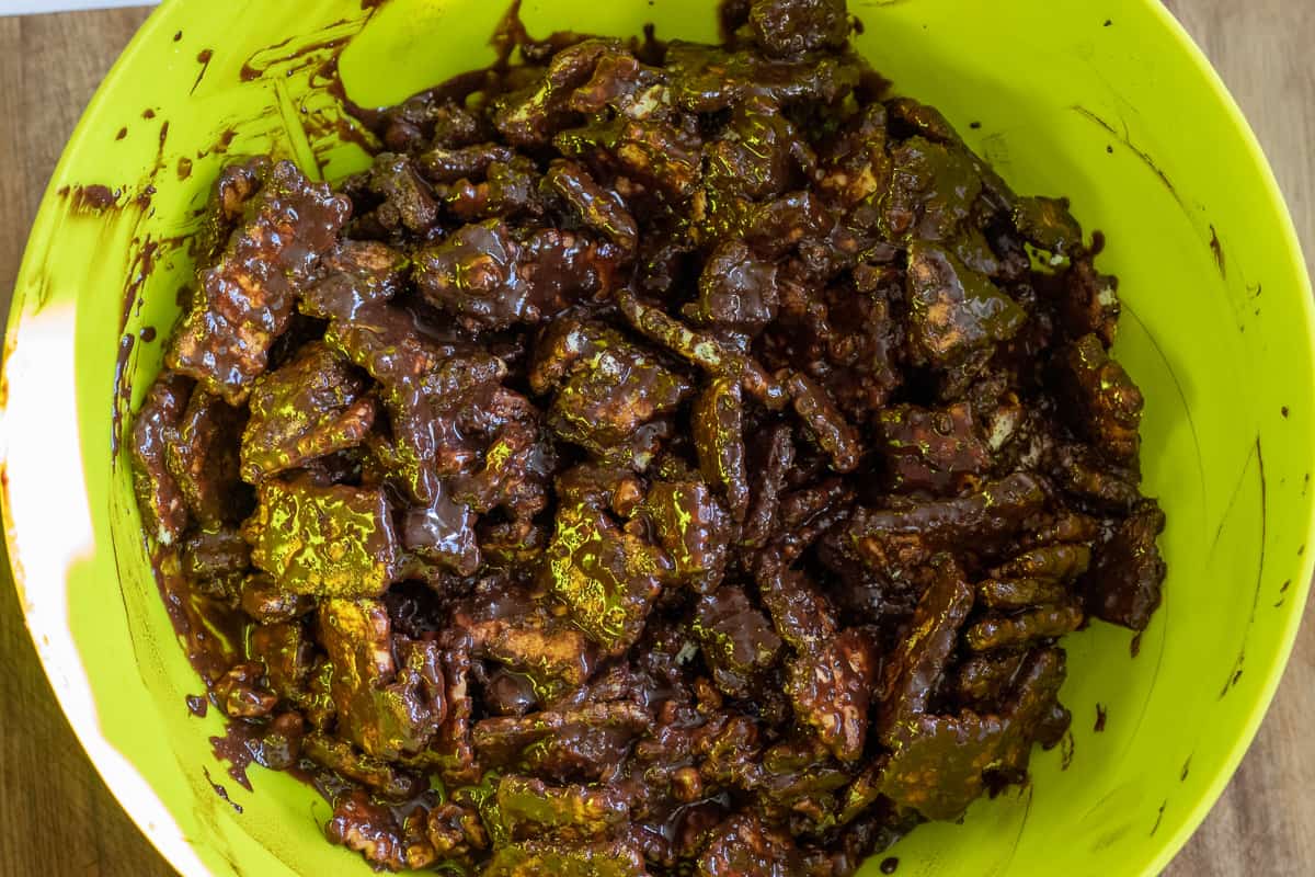 Chocolate sauce is poured on biscuits and walnuts