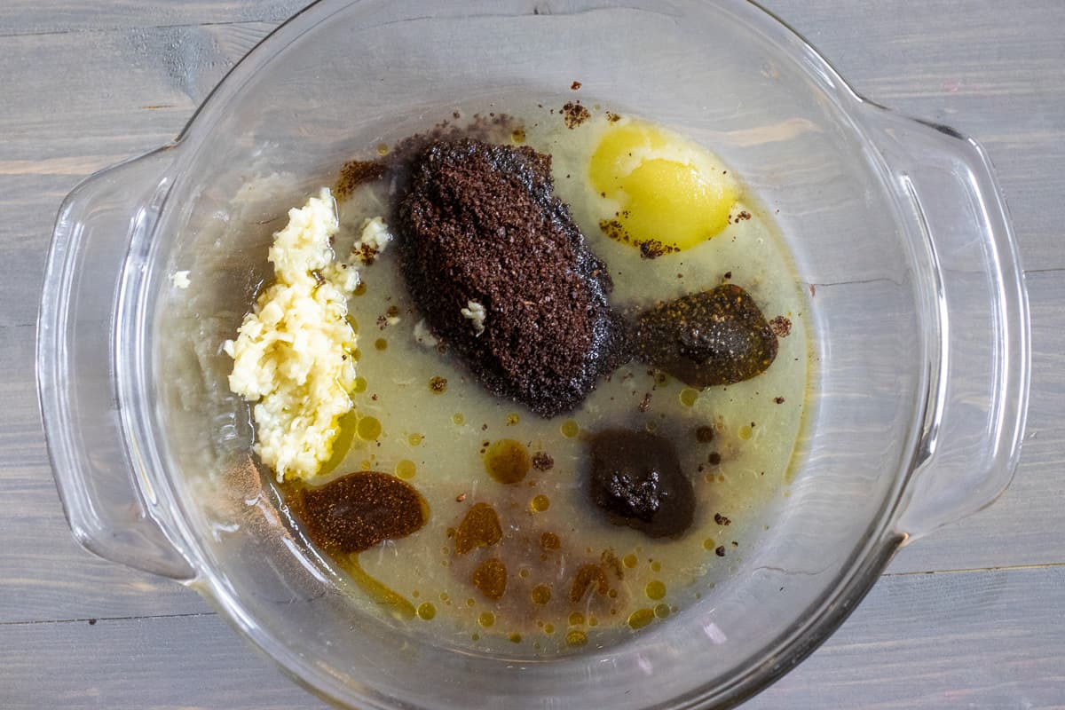 spices, lemon juice, garlic and olive oil are placed in a large bowl