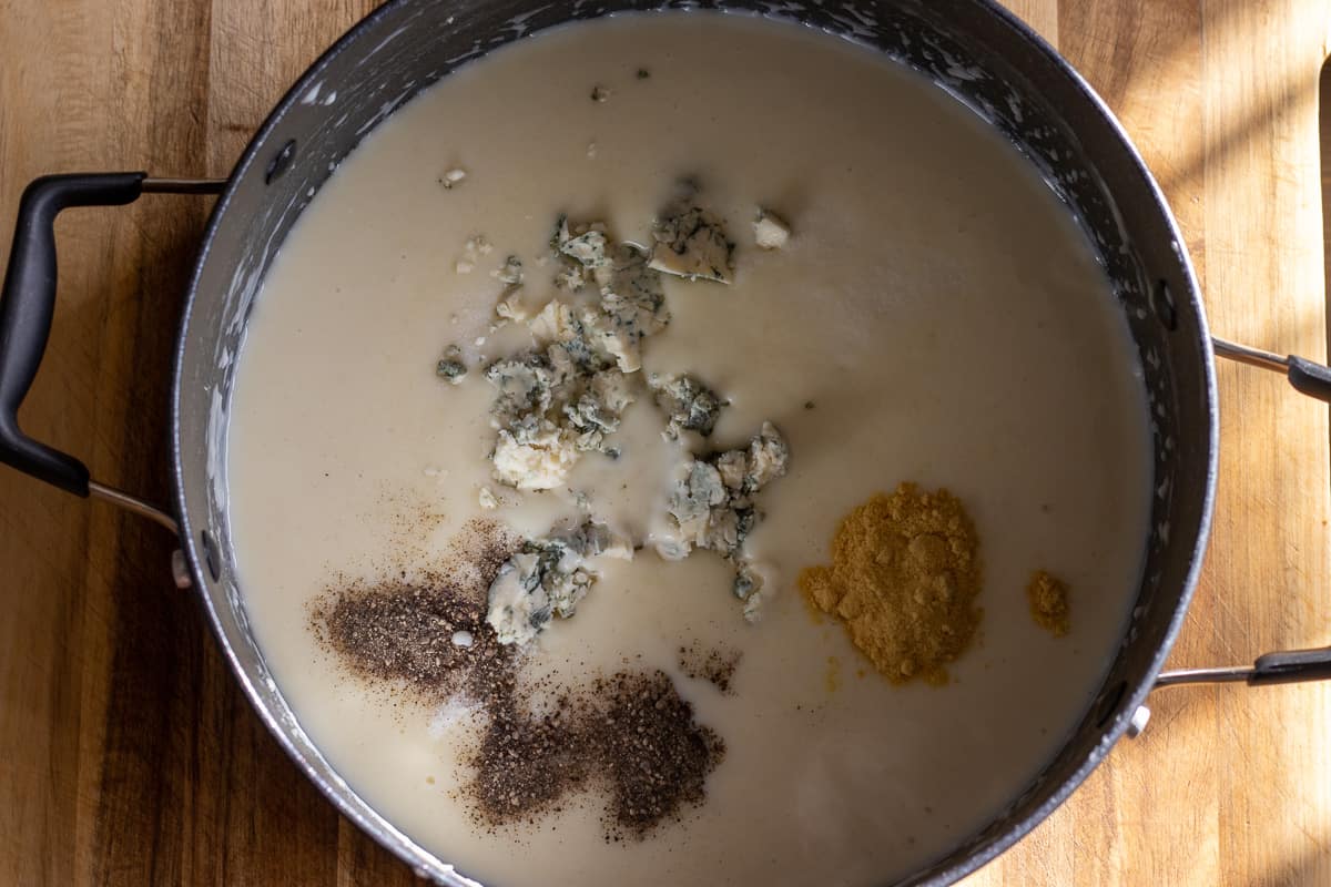 salt, pepper and mustard powder are added to béchamel