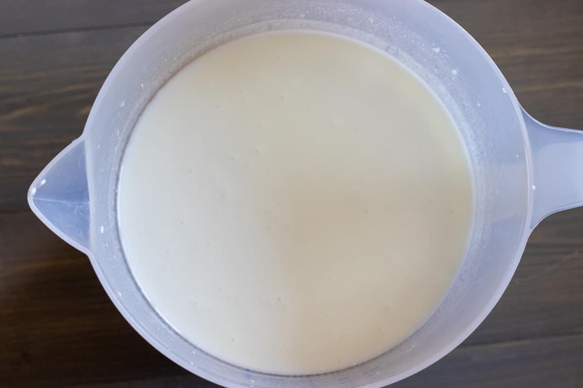 yogurt, water and salt are placed in a jug