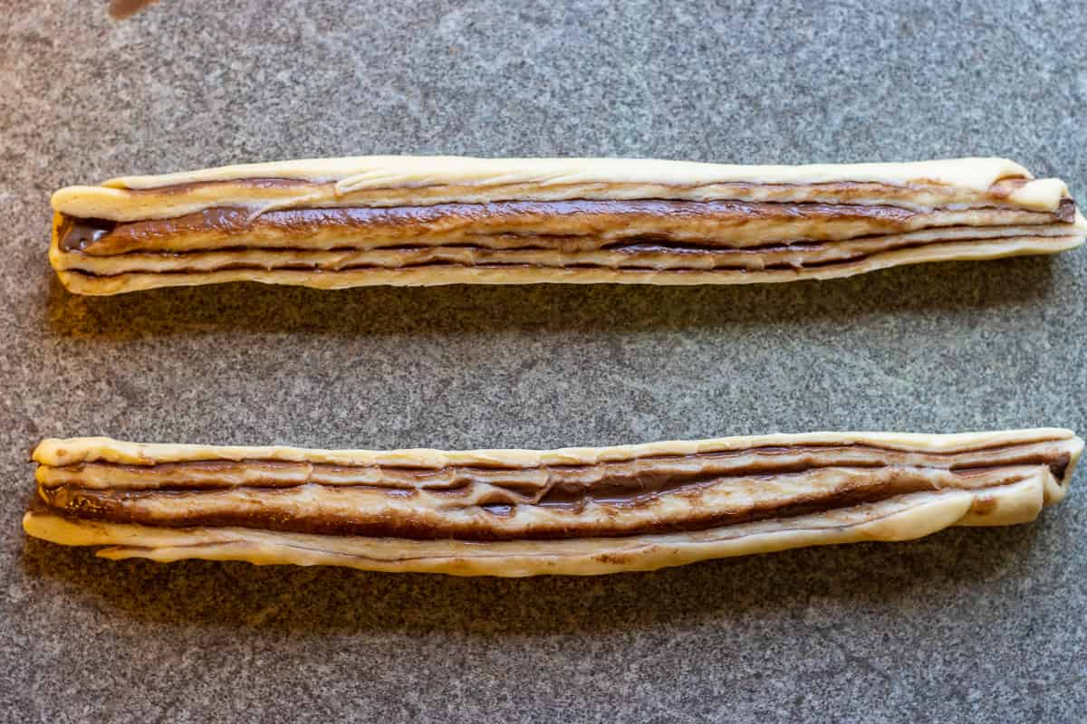 the dough log is cut in 2 lengthways