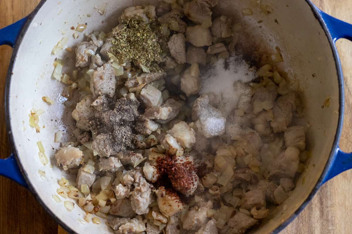 thyme, salt, pepper and chili are added to the lamb