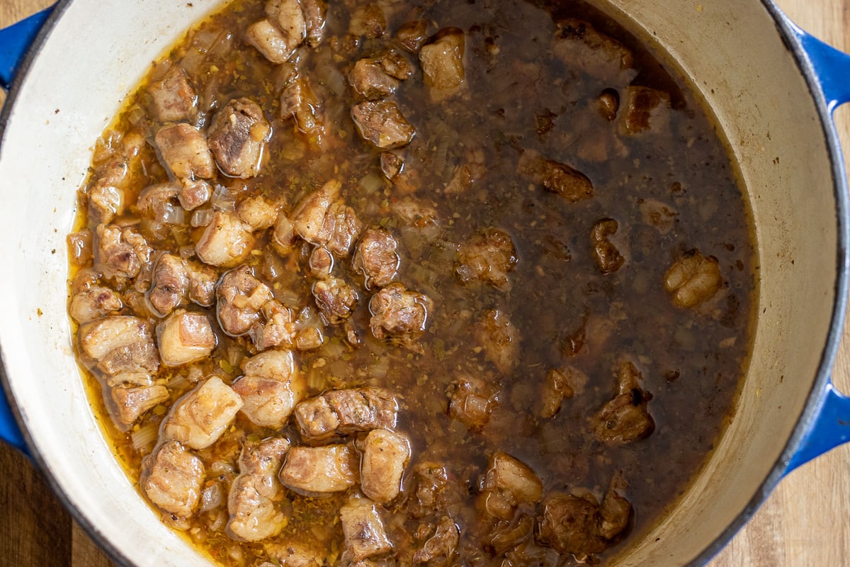 the lamb stew is cooked until the lamb is fork tender