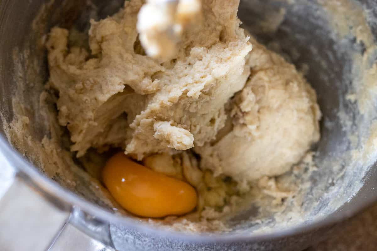 an egg is added to the bowl