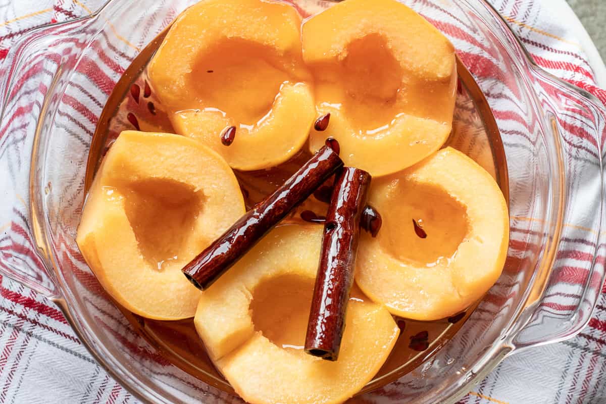 poached quinces are placed on a serving plate