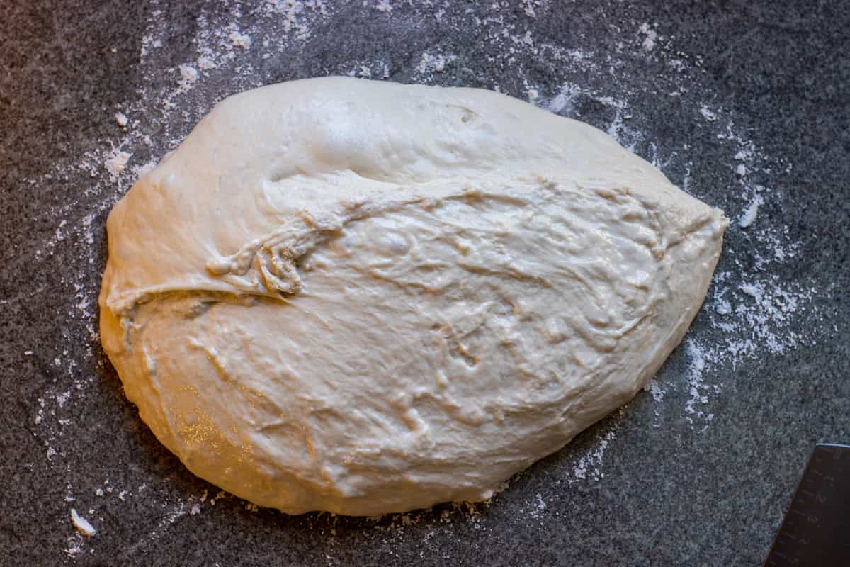 the dough has been transferred on a lightly floured surface
