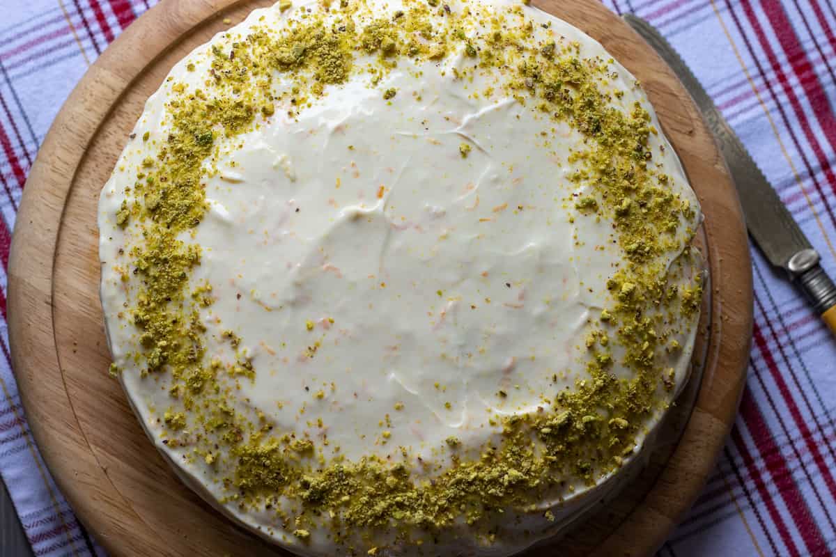 easy carrot cake is decorated with cream cheese frosting