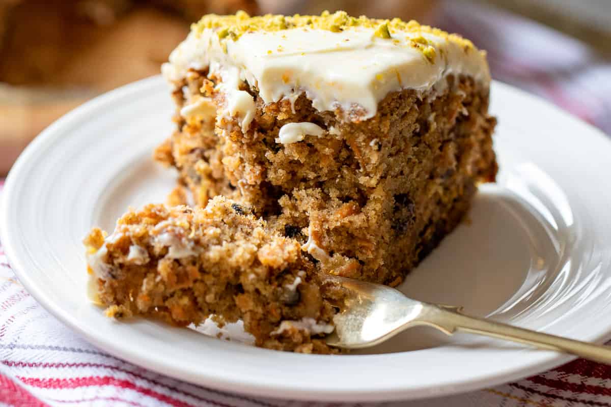 taking a piece of carrot cake from a slice