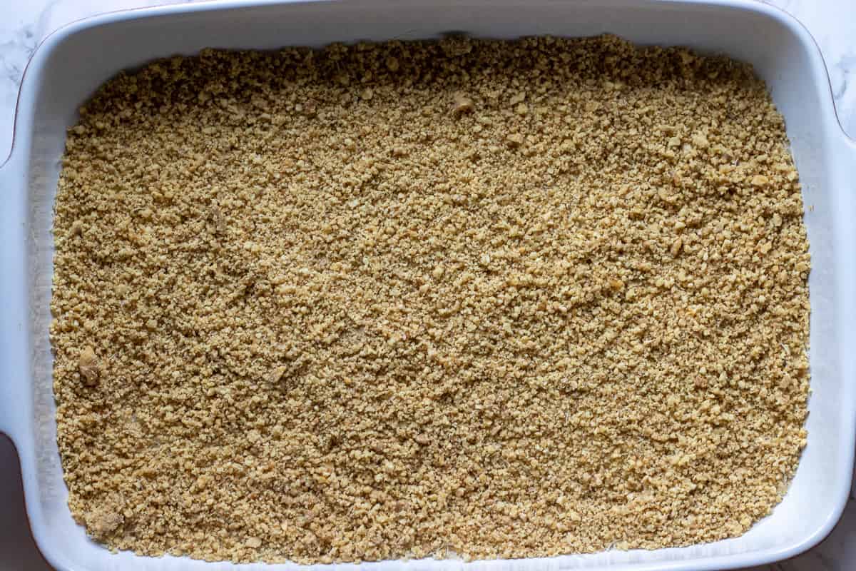 Chopped walnuts are evenly distributed on kadaif pastry