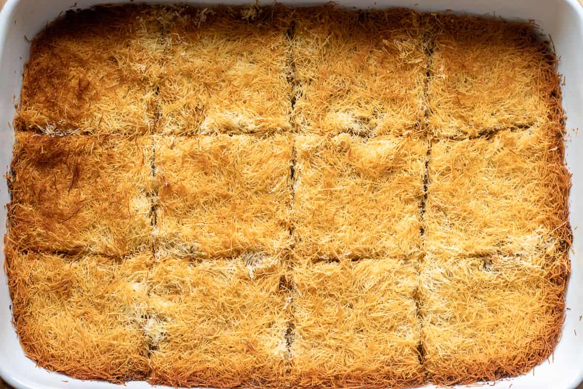 baked kadayif is cut into 12 squares
