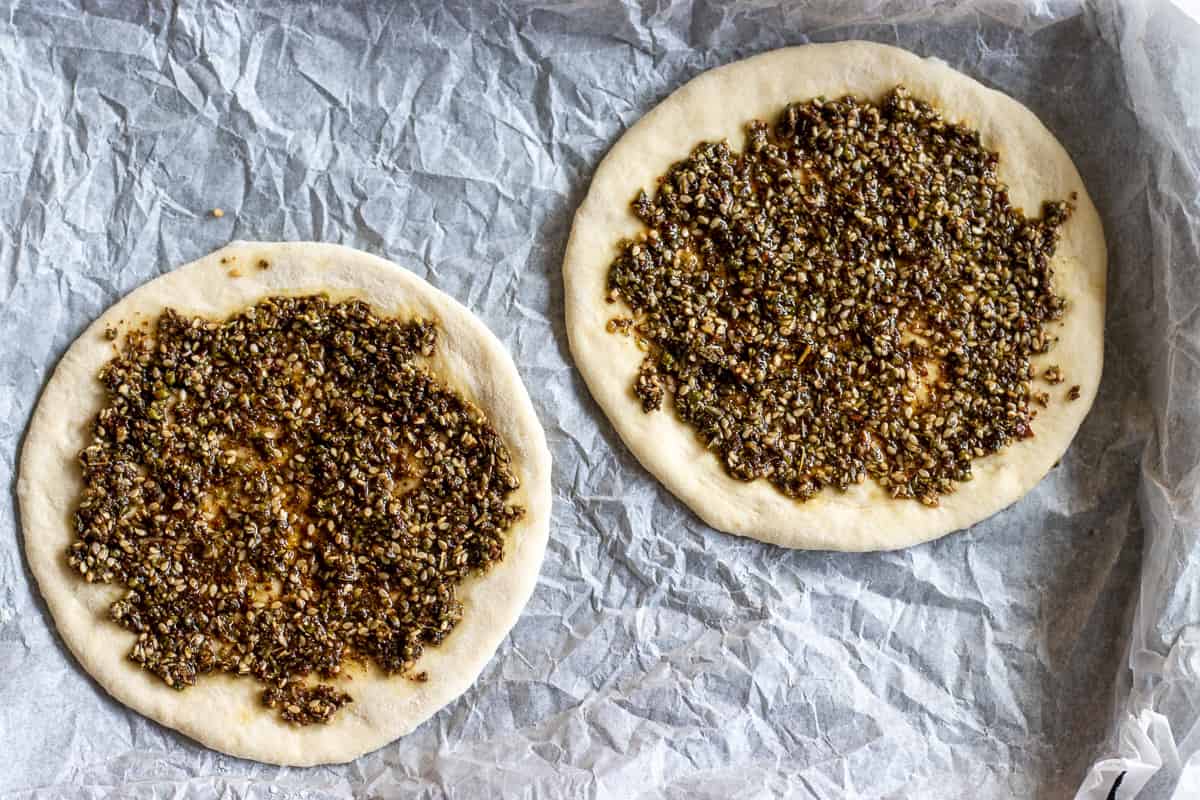 zaatar mixture is spread over the dough circles