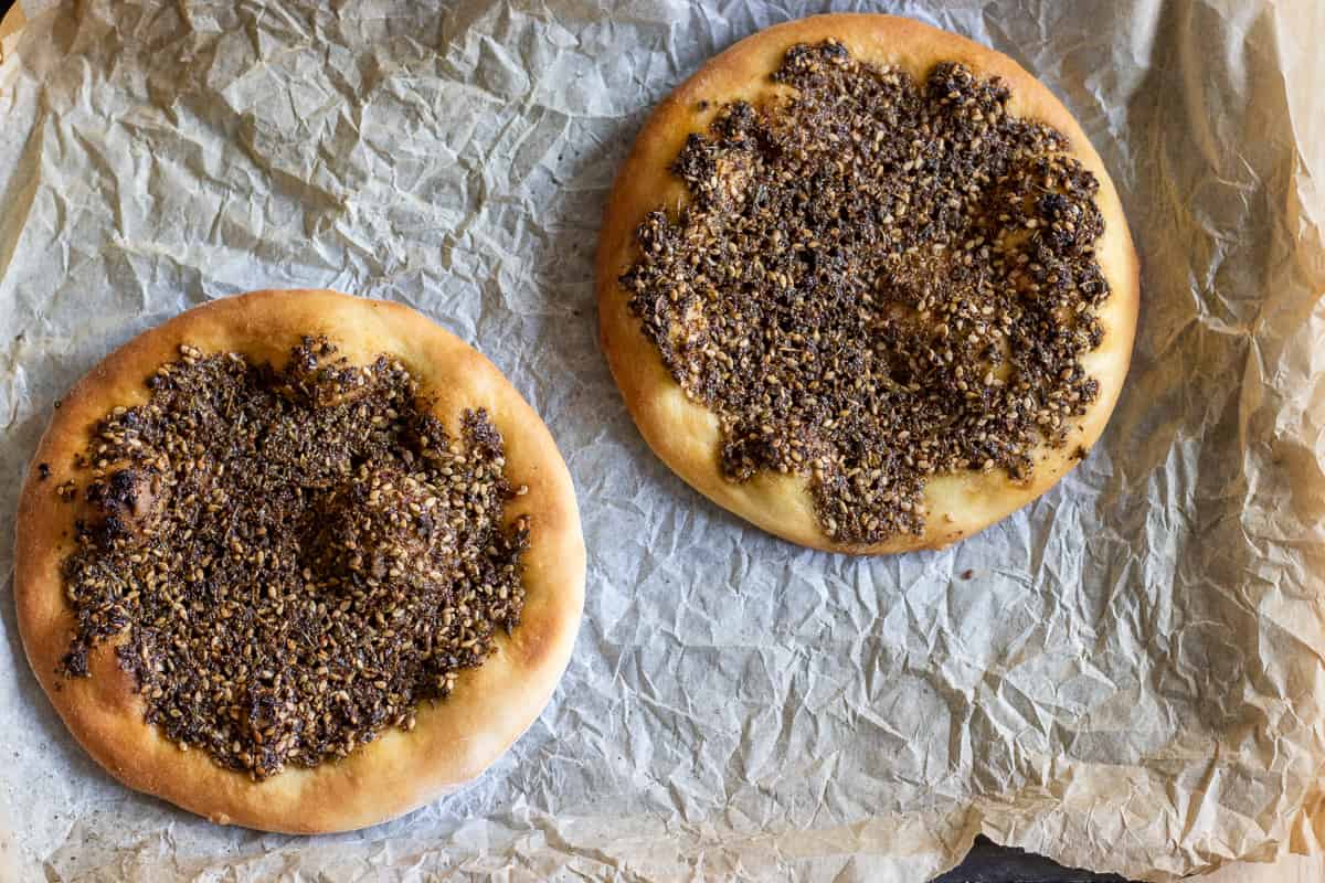 2 zaatar manakish are baked until golden brown on the sides