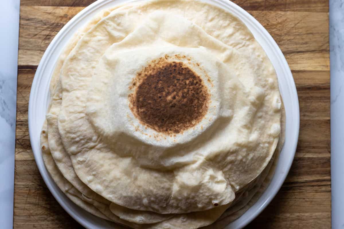 Middle Eastern lavash bread is placed on a plate
