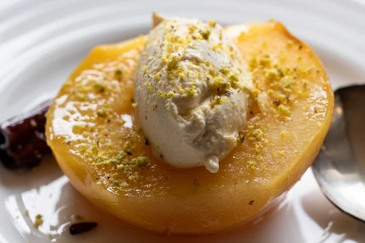 a dollop of kaymak is served with poached quince