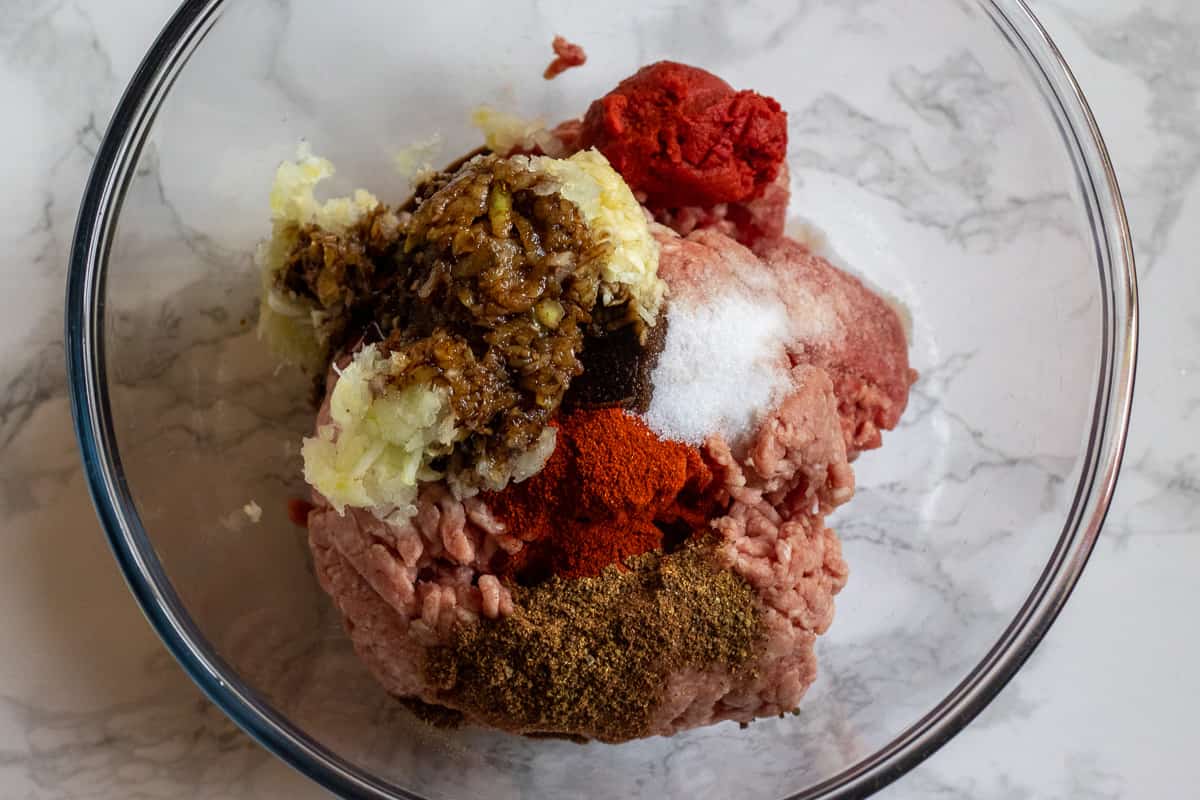 meat filling ingredients for arayes are placed in a bowl